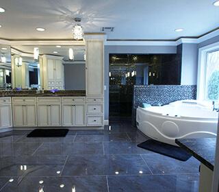Luxury spa bathroom with porcelain tile and exotic granite with leather finish