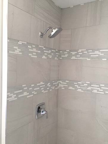 Marble shower with accent strip
