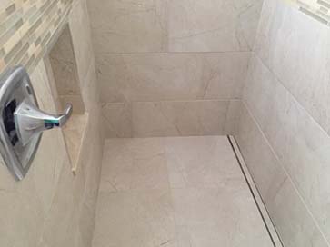 Curbless, walk-in shower with french drain