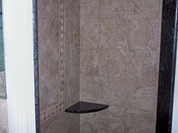 marble shower with granite leg-shaving ledge