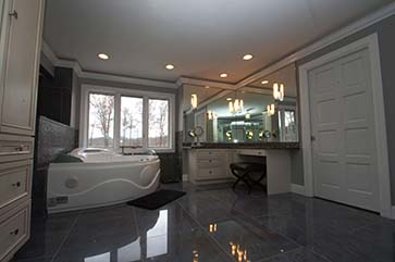 jacuzzi tub and porcelain flooring