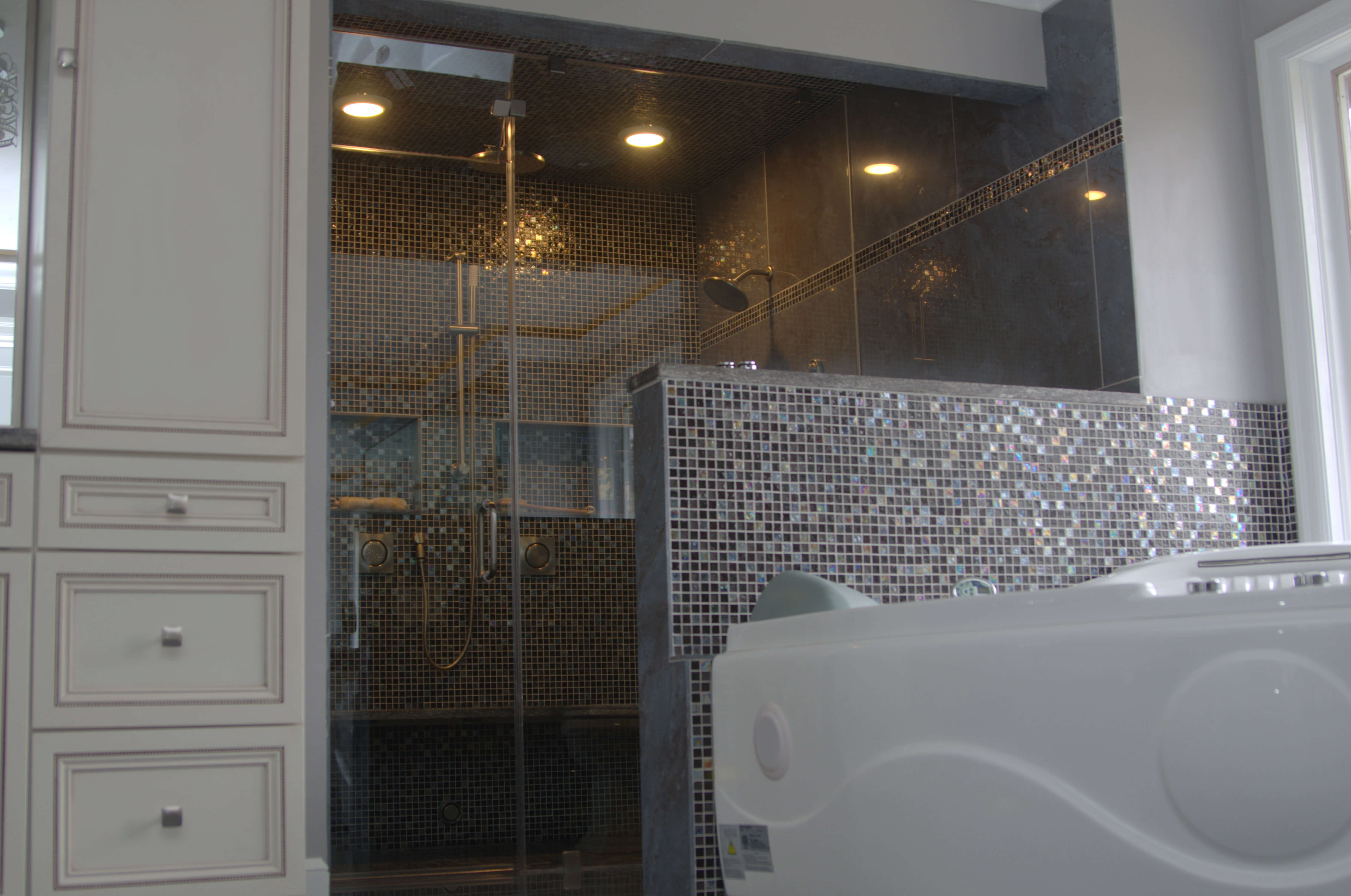 Glass Shower doors with mosaic tile wall